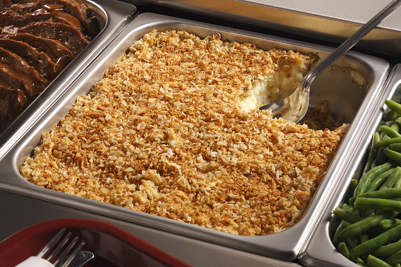 Crunchy Cheesy Baked Mashed Potatoes in a Serving Dish