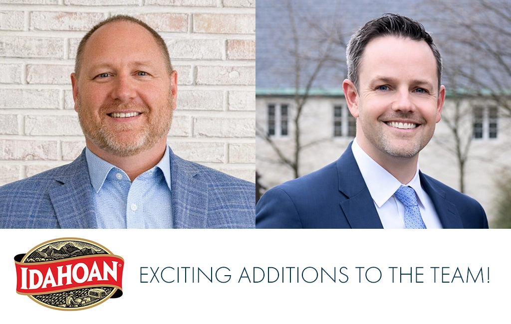 Two men in suits are smiling in separate headshots. The left man stands before a light brick wall; the right man stands outdoors. The Idahoan logo appears below them with the text: Exciting additions to the team!.