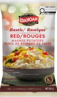 A pouch of Idahoan Rustic Baby Reds mashed potatoes featuring a menu suggestion of Thai curry vegetables in yellow curry sauce.
